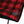 Kuma Outdoor Gear heated chair power button and logo patch on red and black plaid fabric