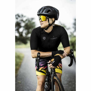 Cyclist wearing Hestra fingerless cycling gloves leaning on handlebars
