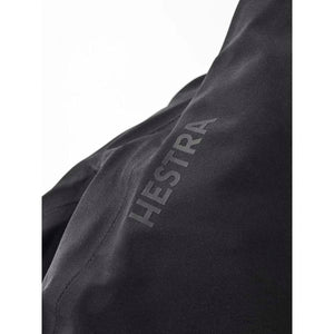 Black Hestra glove fabric detail with brand logo