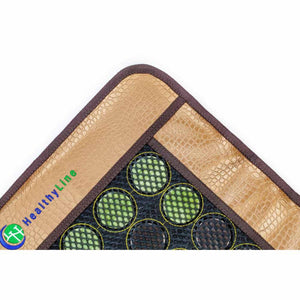 HealthyLine mat corner with textured tan border and embedded green circular discs