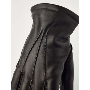 Hestra dark brown leather glove with decorative stitching on the back