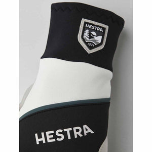 Hestra glove cuff with black and white panels and Hestra logo patch
