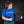 Person wearing a black ThermApparel cooling vest over a blue t-shirt
