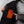 Person pointing to the glowing orange heating element inside an ActionHeat jacket
