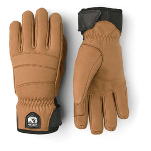 Tan leather Hestra gloves with black wrist straps and logo patch