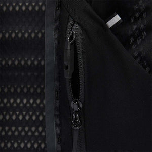 Black Diamond running vest zipper detail showing mesh fabric and reflective trim