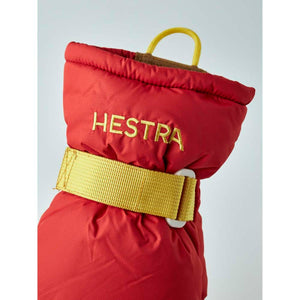 Red Hestra mitten cuff with yellow strap and pull loop