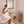 WarmRails freestanding towel warmer in a bathroom with a person holding a towel