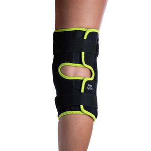 Bionic black knee brace with neon green trim on a leg
