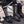 Person wearing black knee high technical socks with white graphic patterns