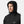 Man wearing a black Helly Hansen hooded rain jacket
