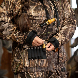 Person wearing DSG Outerwear camouflage hunting jacket with shell holder pocket