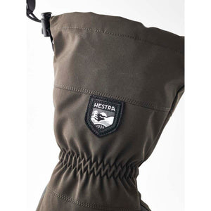 Olive green Hestra glove cuff with drawstring and brand logo patch