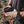 Person holding a Venture Heat battery pack connected to a wrist mounted controller