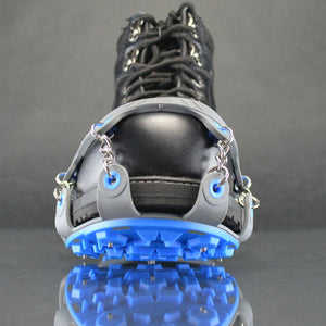 Winter Walking ice cleats attached to a black boot