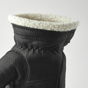 Hestra black leather glove cuff with white shearling lining