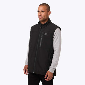 Man wearing a black Mobile Warming heated vest over a grey long sleeve shirt