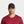 Man wearing a black Mission baseball cap and a maroon crew neck shirt