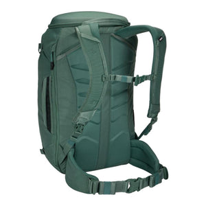 Back view of green Thule backpack showing padded shoulder straps and waist belt