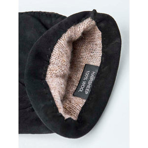 Interior of Hestra black suede glove with wool lining and material label