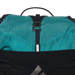Black Diamond backpack top closure with teal grid fabric and black strap