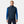 Man wearing a navy Helly Hansen quilted vest over a blue long sleeve shirt