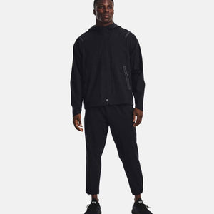 Man wearing Under Armour black hooded windbreaker and matching track pants