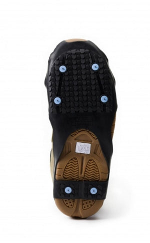 Due North ice traction cleat attached to the sole of a tan boot
