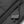 Black plastic zipper pull on a textured fabric garment
