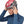 Person wearing a red Black Diamond climbing helmet over a blue hooded base layer