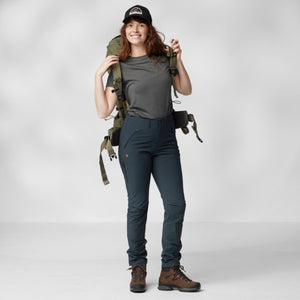 Woman wearing FjallRaven hiking trousers and backpack