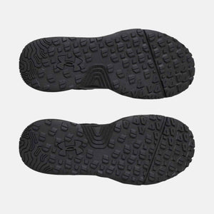 Under Armour shoe outsoles with black lugged tread pattern