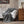 Woolrich grey heated throw blanket with white sherpa lining draped over a sofa