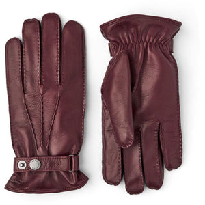Hestra burgundy leather gloves with wrist strap and snap button closure