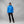 Person wearing a blue FjallRaven hooded down jacket and black trousers