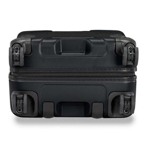 Bottom view of a black Briggs and Riley suitcase showing four spinner wheels