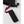 Hestra black wrist strap with red branded pull tab