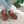 Acorn brown suede moccasin slippers with faux fur lining worn with light wash jeans