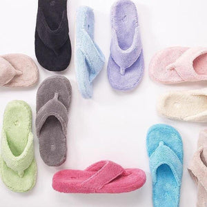 Acorn terry cloth thong slippers in various colors arranged on a white background