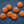 Action Traction orange rubber studs with metal centers on a blue background