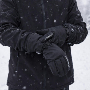 Person wearing black ActionHeat battery heated gloves in snowy conditions