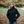 Woman wearing a black ActionHeat heated softshell jacket standing in a park