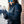 Person wearing ActionHeat black gloves and a black jacket outdoors