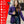 Woman wearing purple ActionHeat jacket with infographic listing features like tri-zone heating and power bank