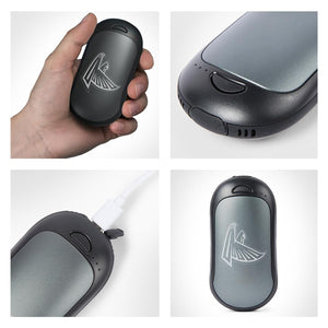 ActionHeat rechargeable hand warmer with team logo held in hand and charging