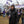 Man wearing ActionHeat black jacket and Baltimore Ravens beanie holding a steaming cup at a tailgate