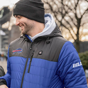 Man wearing a blue and black ActionHeat Buffalo Bills jacket with a black beanie