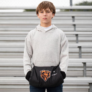 Boy wearing a grey hoodie and a black ActionHeat Chicago Bears hand warmer pouch