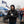Man wearing ActionHeat black jacket and Chicago Bears beanie holding a coffee cup at a tailgate