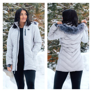ActionHeat women light grey quilted parka with faux fur hood in snowy outdoor setting